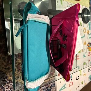 Brand new, never used mini cooler bags. Set of 2 bags, one pink and one teal.